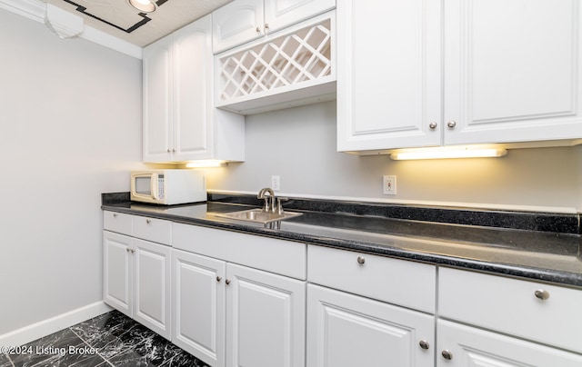 kitchen with white cabinets and sink