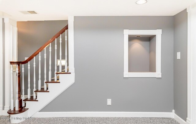 stairway with carpet flooring