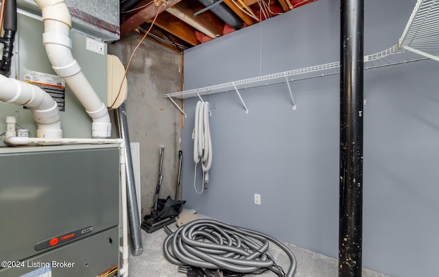 utility room with heating unit