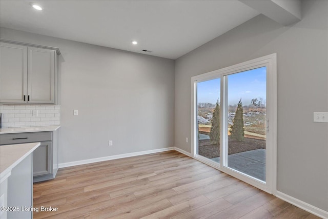 unfurnished dining area with light hardwood / wood-style flooring