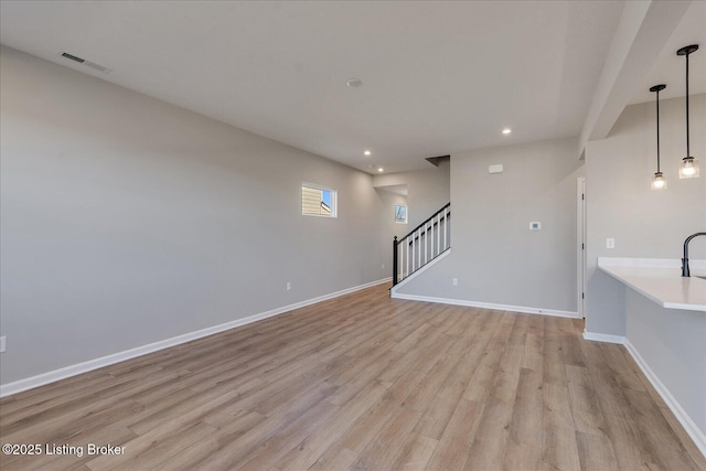 unfurnished living room featuring light wood-type flooring