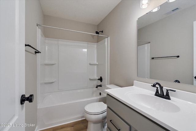 full bathroom featuring vanity, toilet, and shower / washtub combination