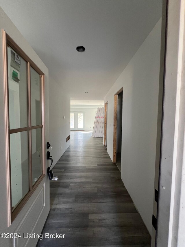 hall featuring french doors and dark hardwood / wood-style floors