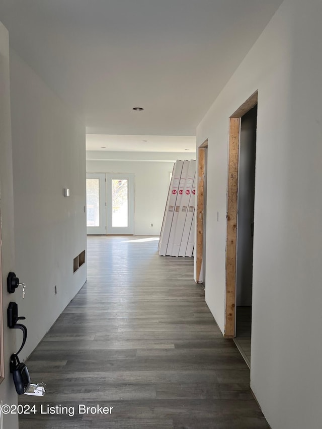 hallway featuring dark wood-type flooring