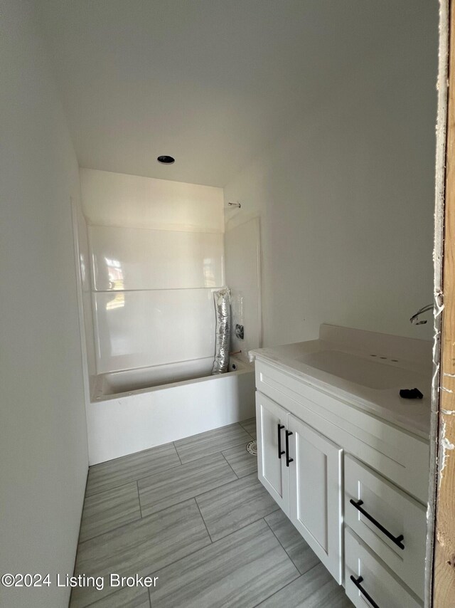 bathroom featuring vanity and shower / tub combination