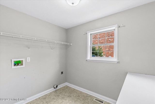 clothes washing area featuring laundry area, baseboards, visible vents, hookup for a washing machine, and electric dryer hookup