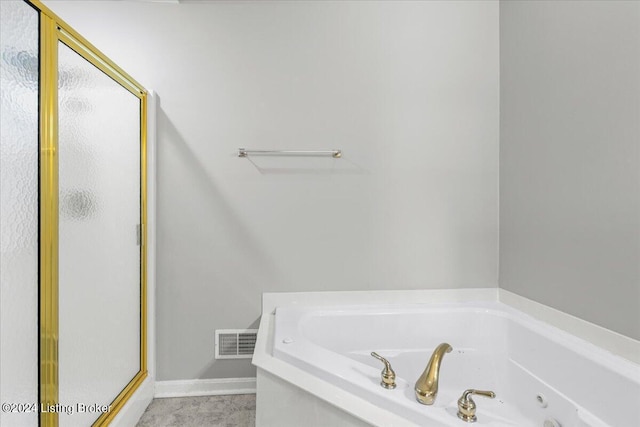 bathroom with a stall shower, baseboards, visible vents, and a whirlpool tub