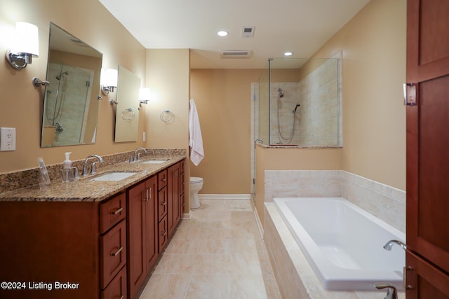 full bathroom with tile patterned floors, vanity, independent shower and bath, and toilet