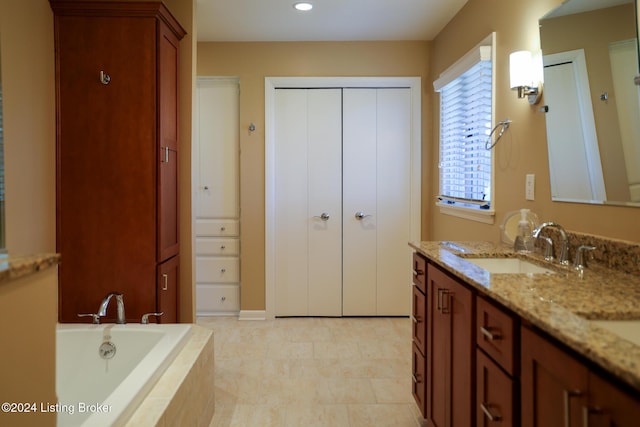 bathroom with vanity and a relaxing tiled tub