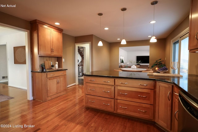 kitchen featuring dishwasher, decorative light fixtures, and hardwood / wood-style flooring