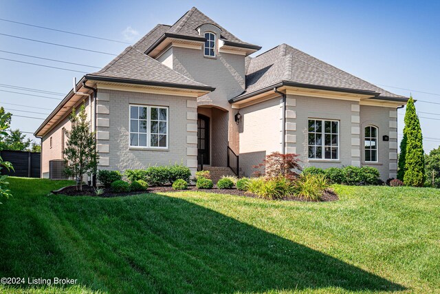 view of front of home with a front yard