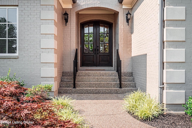 entrance to property with french doors and brick siding