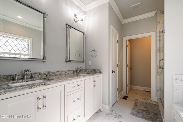 bathroom featuring tile patterned floors, a shower with shower door, crown molding, and vanity