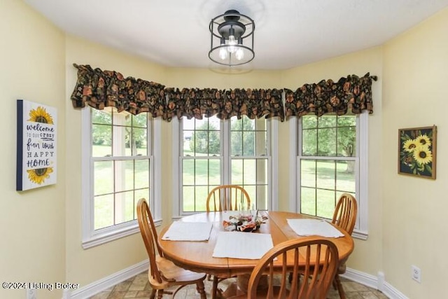 dining space featuring light tile patterned floors