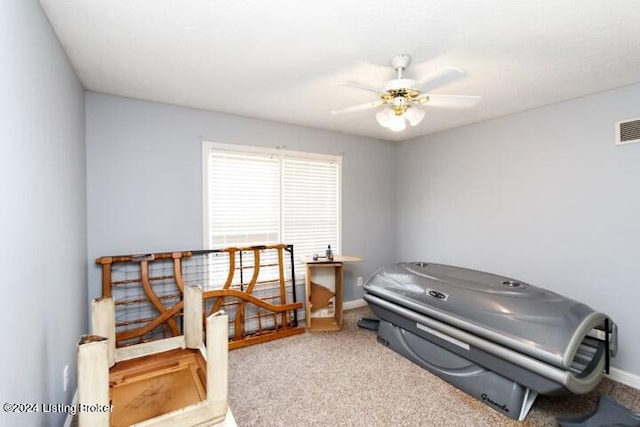 interior space with ceiling fan and light carpet