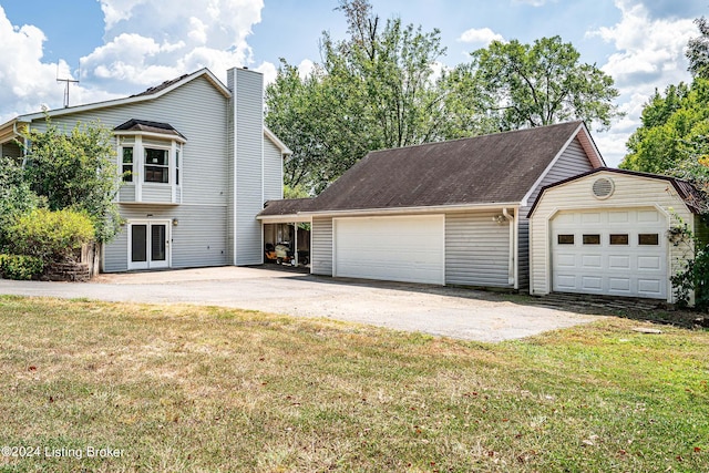 exterior space featuring a yard and a garage