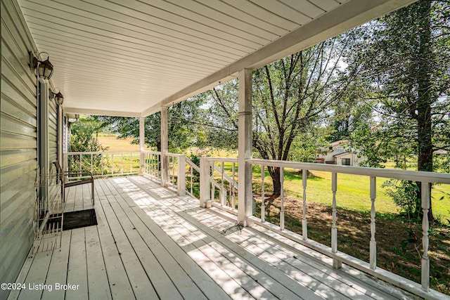 wooden terrace with a storage unit