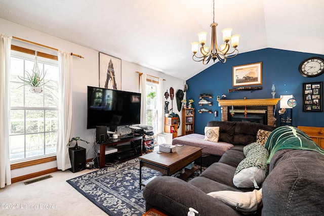 carpeted living room with a fireplace, a notable chandelier, and vaulted ceiling