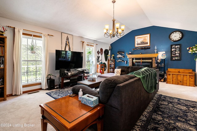 carpeted living room featuring vaulted ceiling, a chandelier, and a fireplace