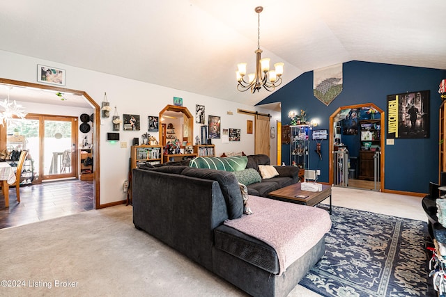 carpeted living room featuring vaulted ceiling, a chandelier, and a barn door