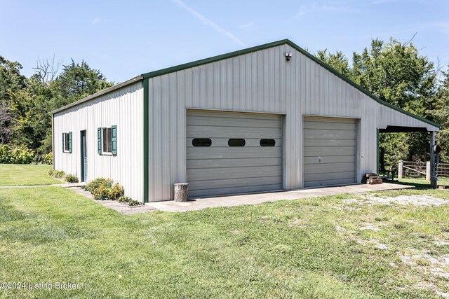 garage with a yard