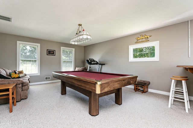 playroom with a textured ceiling, carpet floors, and pool table