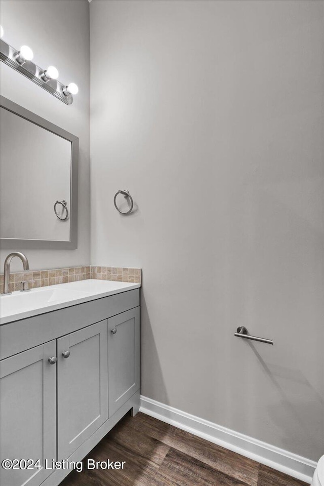 bathroom with vanity and hardwood / wood-style floors