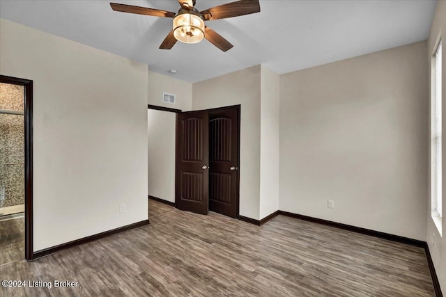 unfurnished bedroom with ceiling fan and light hardwood / wood-style floors