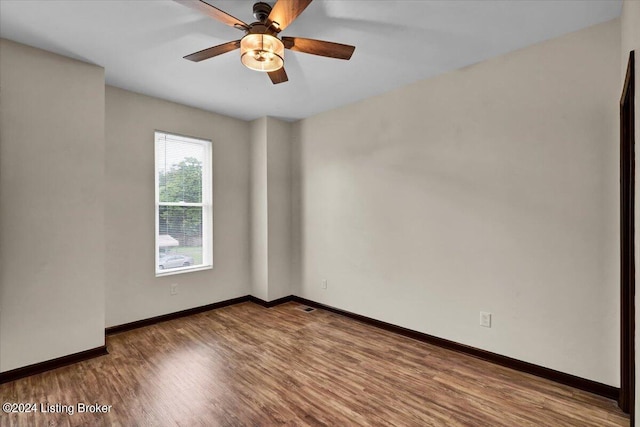 spare room featuring ceiling fan and hardwood / wood-style flooring