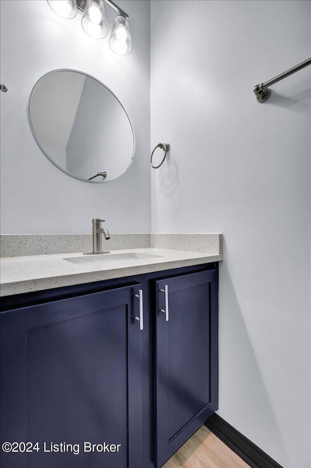 bathroom with wood-type flooring and vanity