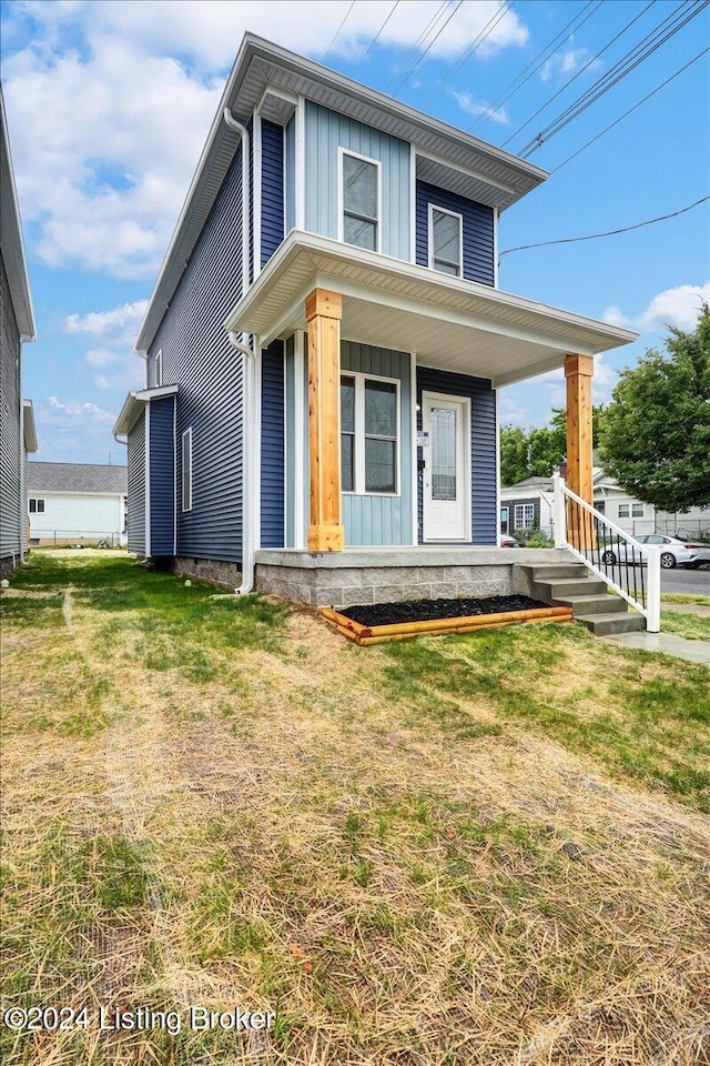 view of front of home featuring a front lawn and a porch