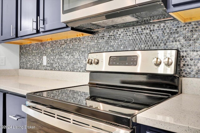 kitchen with stainless steel electric range, decorative backsplash, and light stone countertops