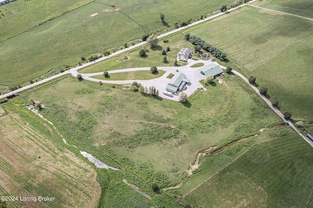 birds eye view of property with a rural view