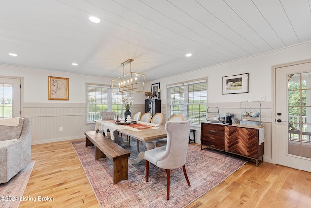 dining room featuring an inviting chandelier and light hardwood / wood-style floors