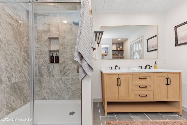 bathroom with vanity, walk in shower, and tile patterned floors