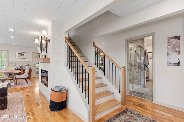 stairway with hardwood / wood-style flooring