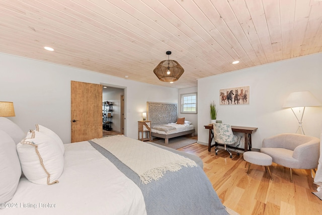 bedroom with wood ceiling and light hardwood / wood-style floors