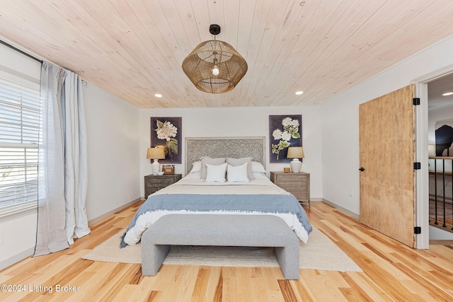 bedroom with wood ceiling and light hardwood / wood-style floors