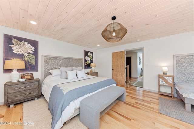 bedroom featuring wood ceiling and light hardwood / wood-style flooring