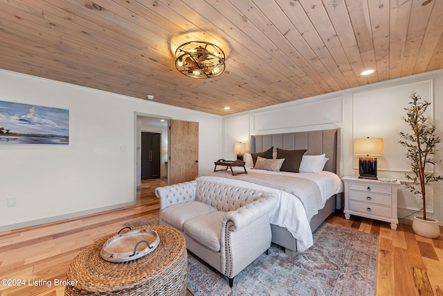 bedroom featuring wooden ceiling and light hardwood / wood-style floors