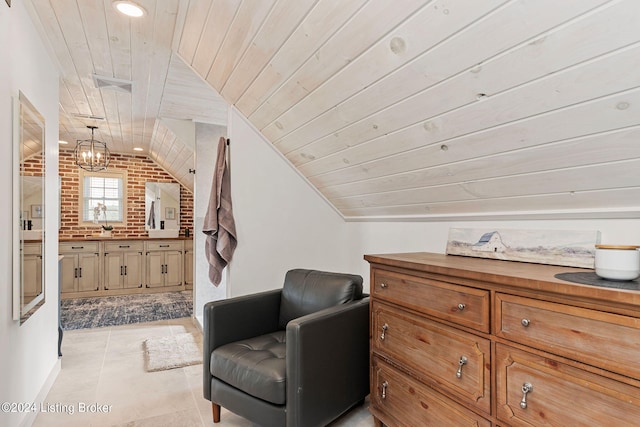 sitting room with brick wall, vaulted ceiling, light tile patterned floors, and wooden ceiling