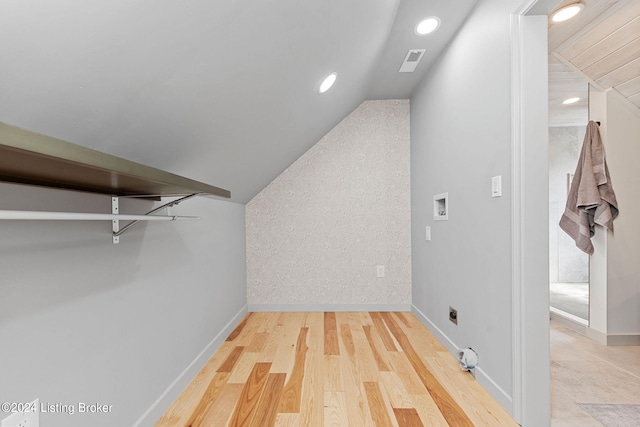 interior space with lofted ceiling and wood-type flooring