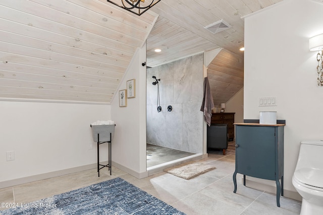 bathroom featuring a shower, wood ceiling, and toilet