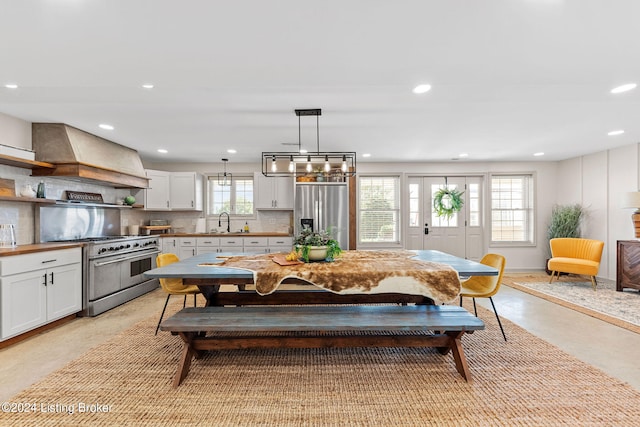 dining space with a wealth of natural light and sink