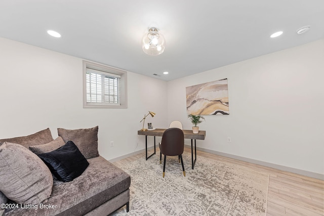 office with light hardwood / wood-style floors