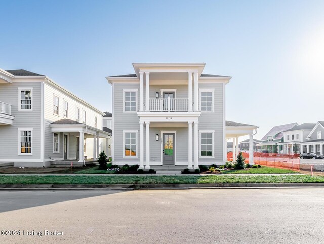 neoclassical home with a balcony