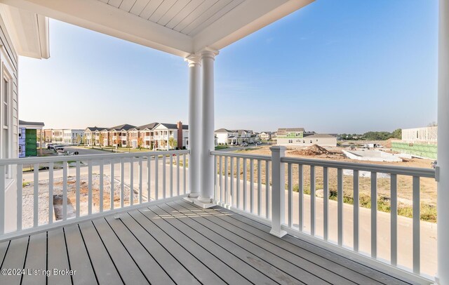 wooden terrace with a residential view