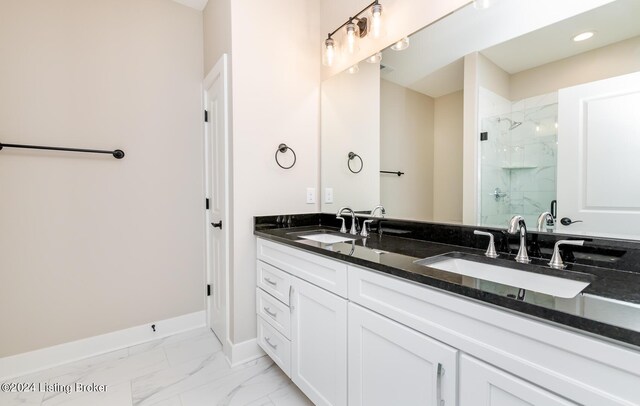 bathroom with tile patterned flooring, a shower with shower door, and vanity