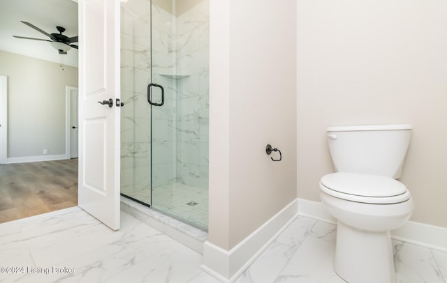 bathroom featuring toilet, an enclosed shower, tile patterned floors, and ceiling fan