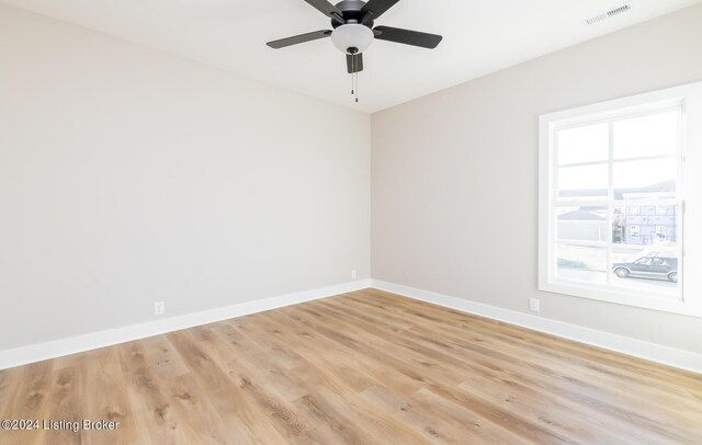 unfurnished room featuring light hardwood / wood-style flooring and ceiling fan